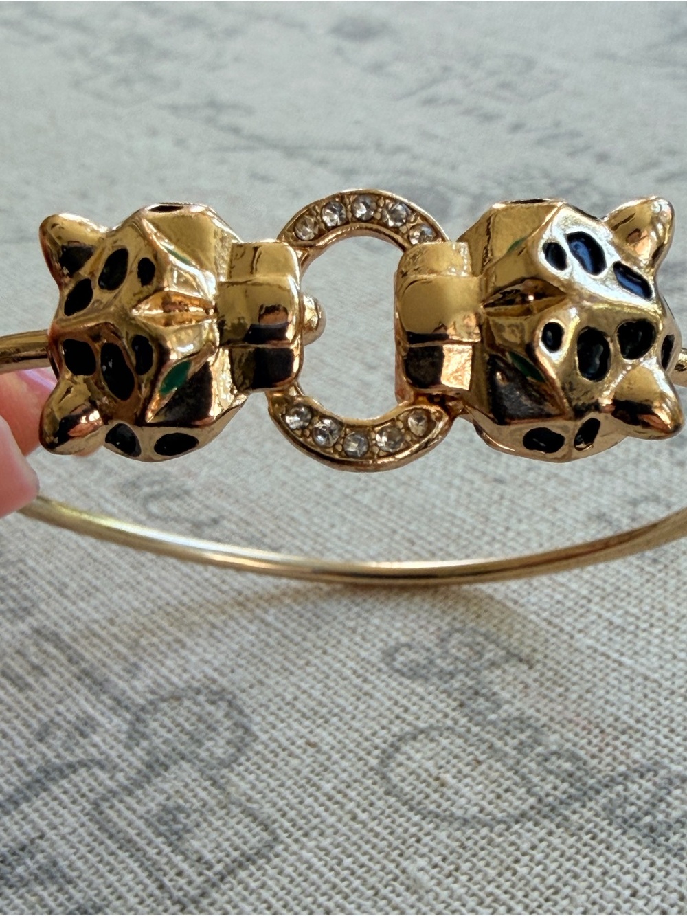 Gold-Tone Panther Head Bangle Bracelet with Crystal Ring Accent